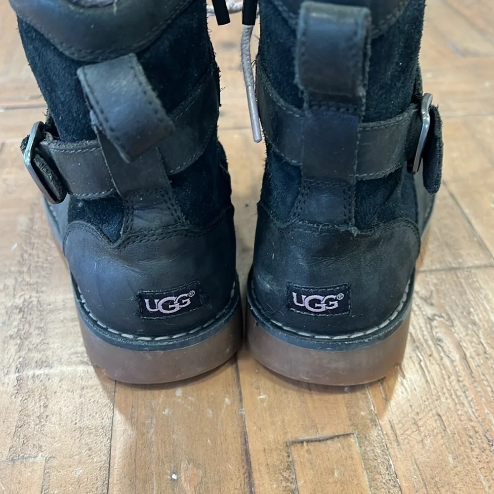 Ugg Koren black leather buckle strap lug sole boots